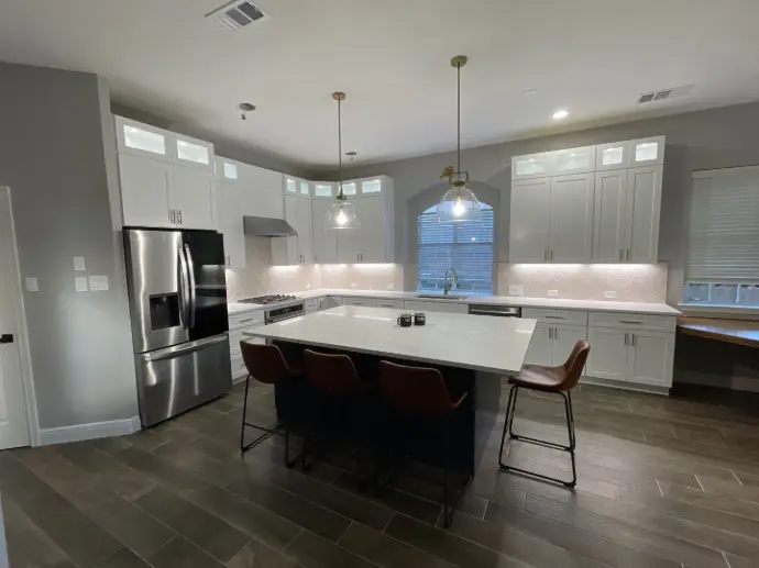 One of our remodeled kitchens with luxury cabinets and pendant lighting